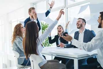 3 women and 3 men celebrating